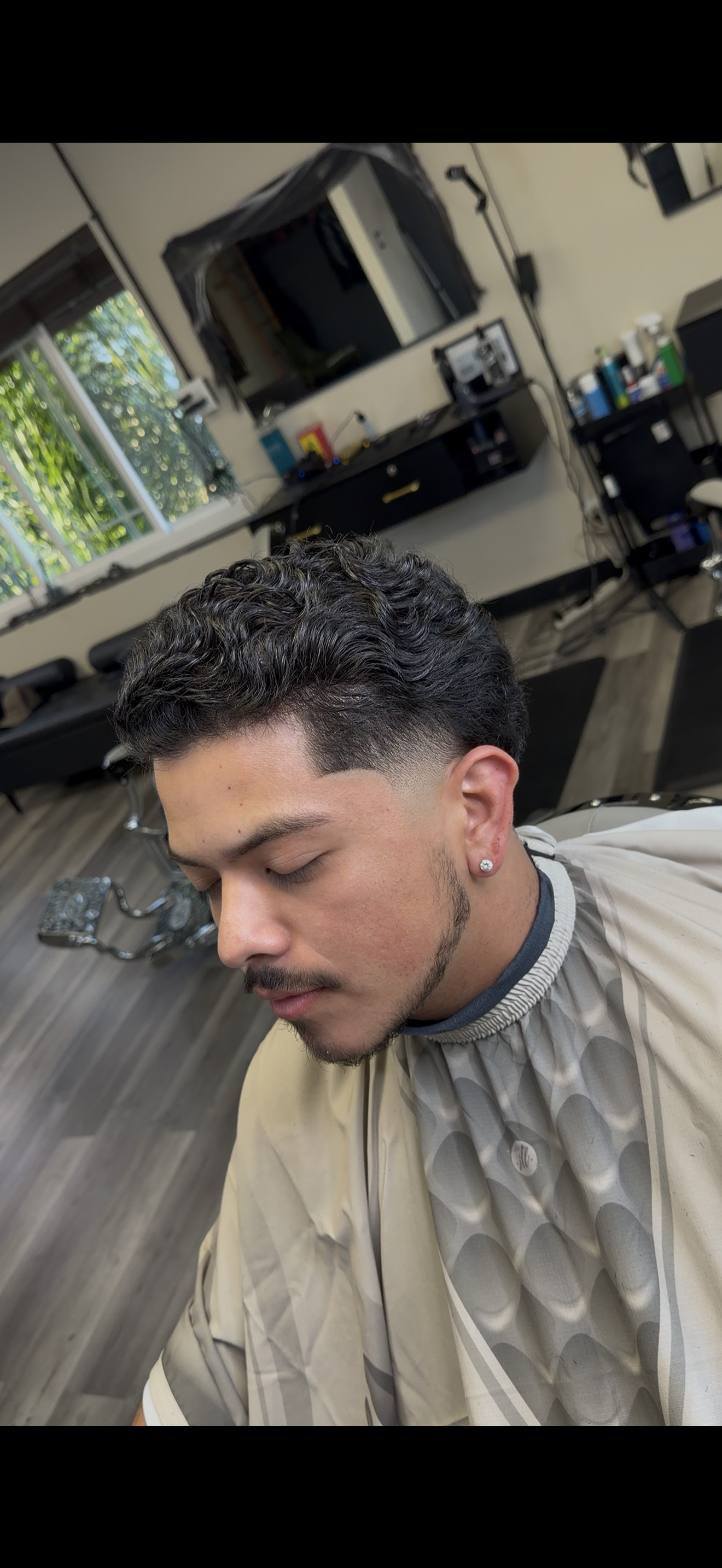 Curly top taper fade at Javistylz barbershop Richmond CA