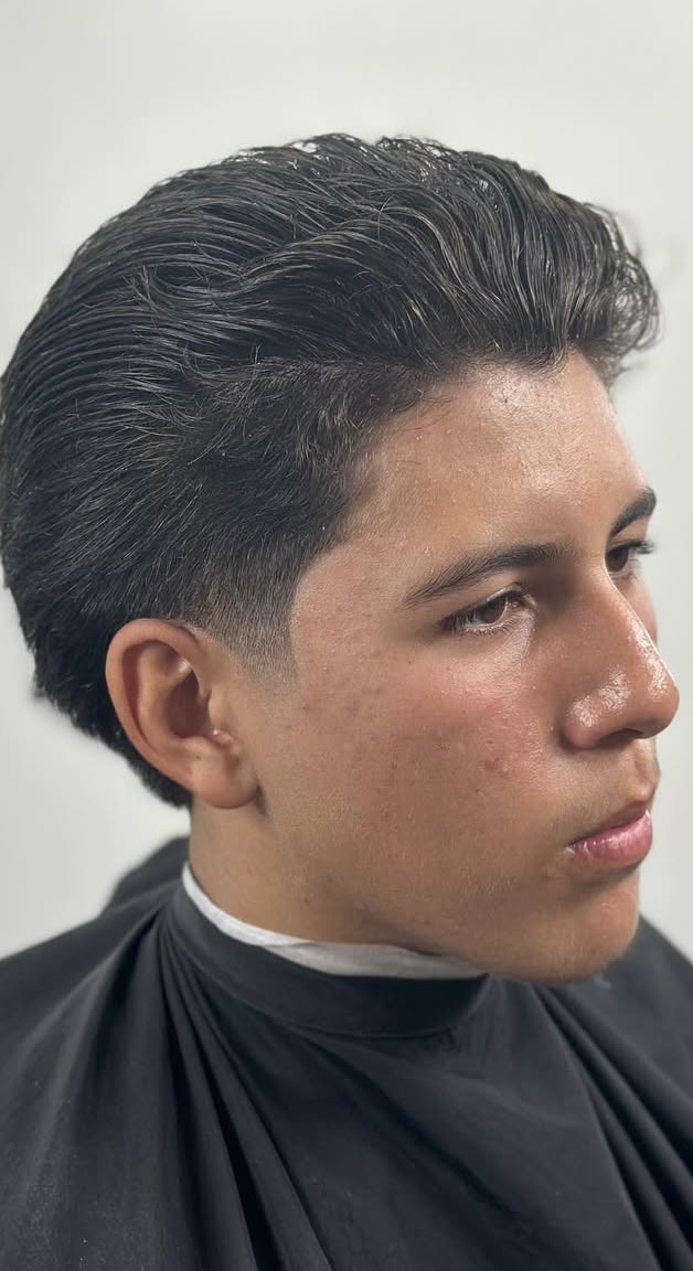 Classic slicked back pompadour with taper by Javistylz Richmond